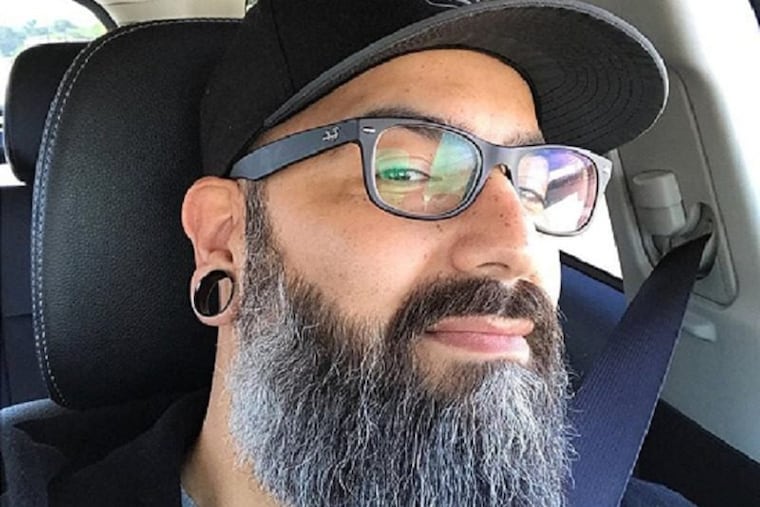 Joe Roman sports quite the full salt and pepper beard.