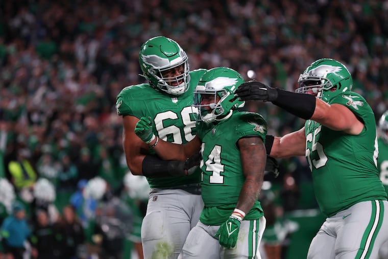 Philadelphia Eagles running back Kenneth Gainwell celebrates with Philadelphia Eagles offensive tackle Jordan Mailata and Philadelphia Eagles offensive tackle Lane Johnson after tumbling into the end zone during the fourth quarter against the Miami Dolphins at Lincoln Financial Field on Sunday, Oct. 22, 2023, in Philadelphia , PA.