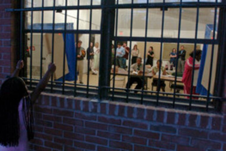 Where best to do some constitutional-right exercising than at a playground? Here, a young girl peeks through the window at Weccacoe Playground in South Philly, where voters waited in line as long as 45 minutes to vote.