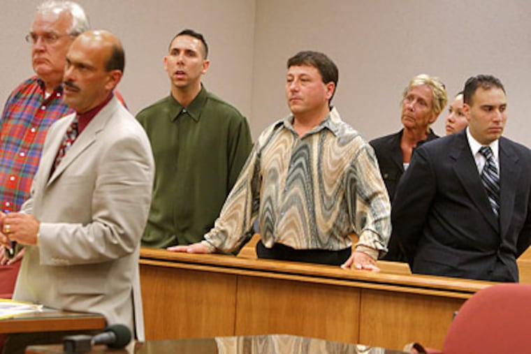 Jack Buscemi Jr. (center, wearing the patterned shirt) was described as the boss of a $60 million betting ring based at the Borgata hotel in Atlantic City. (David M Warren/Staff file photo)