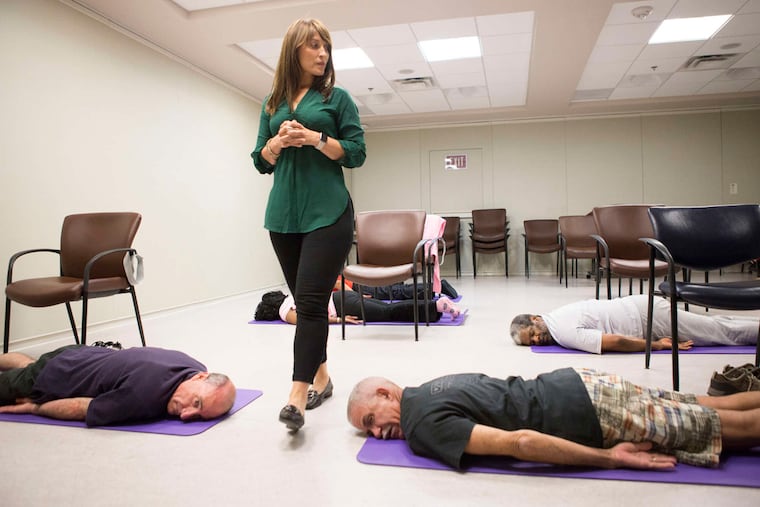 Yoga Teacher Lisa Rambaldo leads a Yoga class at the VA Medical Center, Thursday, July 14, 2016, in Philadelphia.