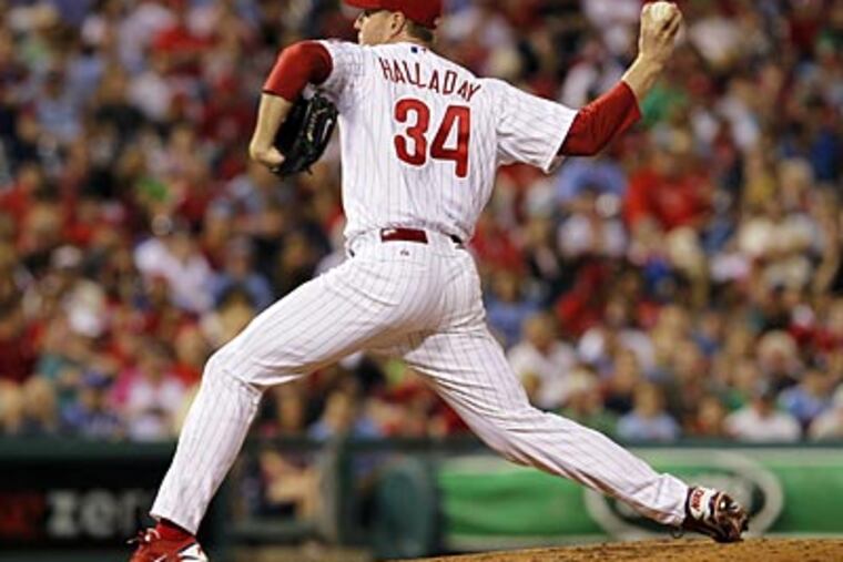 Roy Halladay pitched seven innings, allowed two runs on seven hits, and struck out 10 on Saturday. (Alex Brandon/AP)