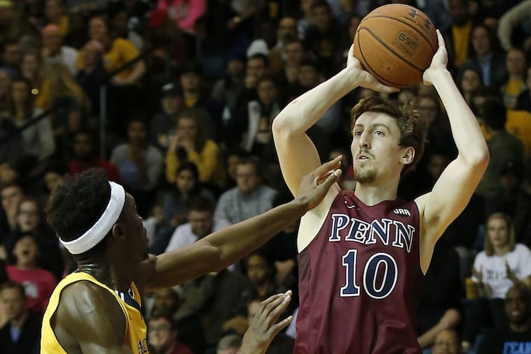 Penn guard Caleb Wood shoots the basketball over La Salle guard Cleon Roberts at Gola Arena on Wednesday, January 25, 2017 in Philadelphia.