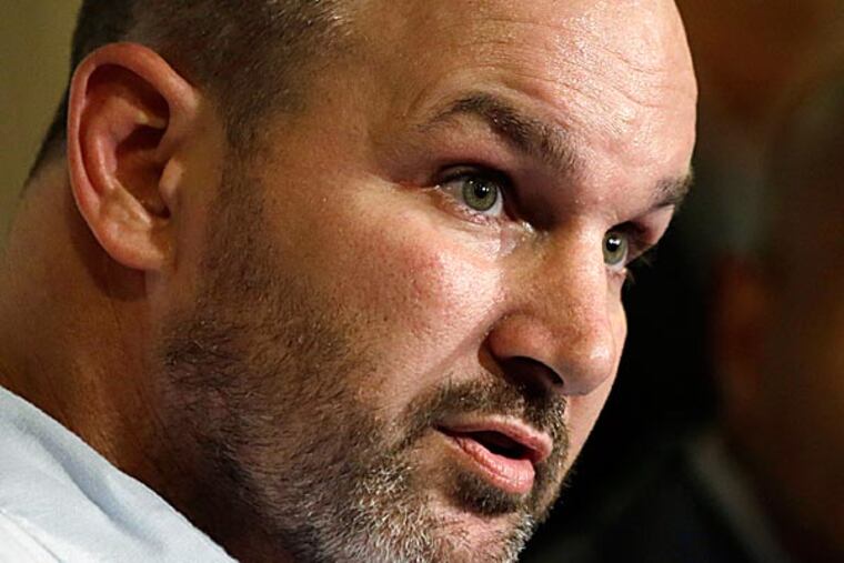 While Kevin Turner still can walk, ALS already has started ravaging his upper body. (Matt Rourke/AP)