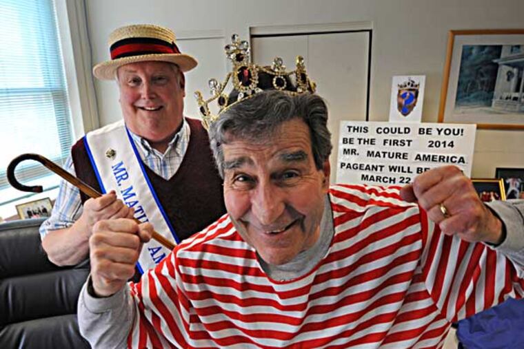 In Ocean City, NJ, Mark Soifer, executive director of the Mr. Mature America Pageant (in old-fashioned striped bathing suit) and his assistant executive director Ray Esterlund with crown, sash and accessories that will be used in the upcoming competition, photographed on Feb. 26, 2014. ( APRIL SAUL / Staff )