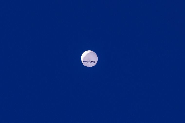 In this photo provided by Chad Fish, a large balloon drifts above the Atlantic Ocean, just off the coast of South Carolina, on Saturday.