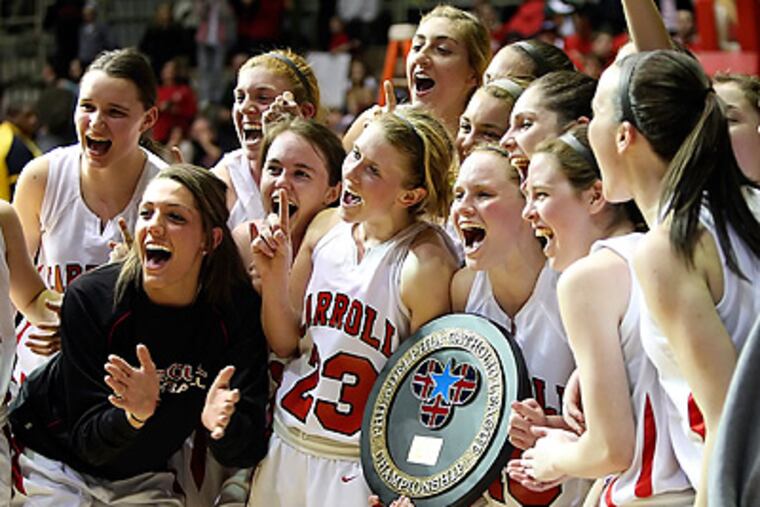 Carroll celebrates after beating Wood 51-37 in the Catholic League girls' championship basketball game at the Palestra. (Steven M. Falk / Staff Photographer )