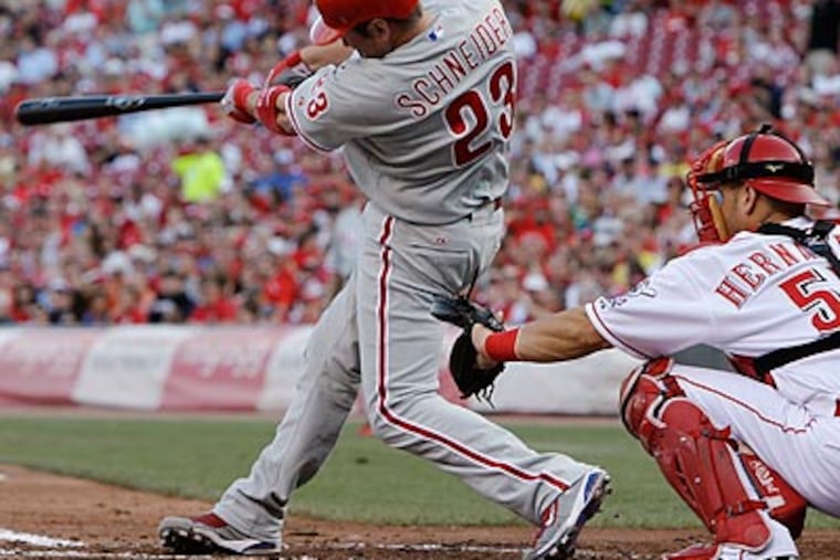 Brian Schneider hit a three-run home run in the second inning to spark the Phillies' offense. (AP Photo/Al Behrman)