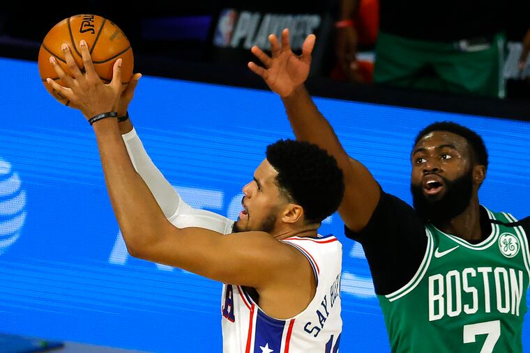 Tobias Harris, left, of the 76ers goes up for a shot against Jaylen Brown, right, of the Boston Celtics during the first half of Game 2 of the first-round playoff series on Wednesday.
