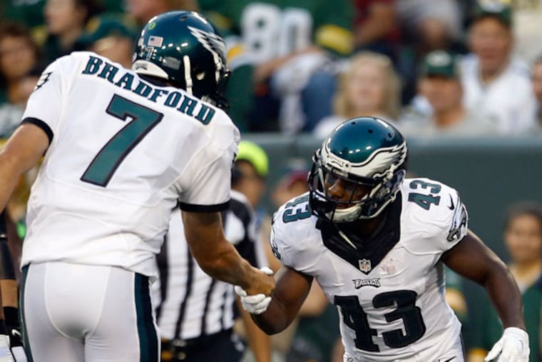 The Eagles' Darren Sproles celebrates his first-quarter touchdown reception with Sam Bradford against the Green Bay Packers in a preseason game on Saturday, Aug. 29, 2015 in Green Bay, Wis. (YONG KIM/Staff Photographer)