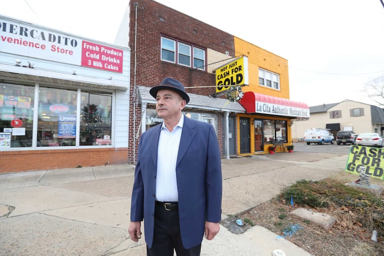 Shop keeper is Marco Gigliello is the owner of Erlton Cash for Gold, Thursday December 15, 2016 ( DAVID SWANSON / Staff Photographer )