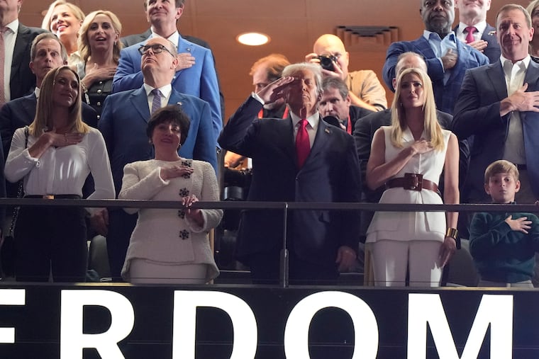 President Donald Trump, joined by members of his family, watches from a suite prior to Sunday's Super Bowl between the Eagles and the Kansas City Chiefs in New Orleans.