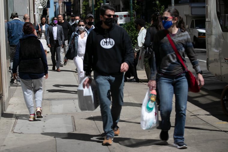 People shop along Walnut Street in Center City in 2021. The foot traffic has changed since the pandemic ended.