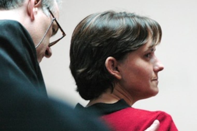 Defense attorney Tony Farese comforts Mary Winkler during jury deliberations. She now faces three to six years in prison.