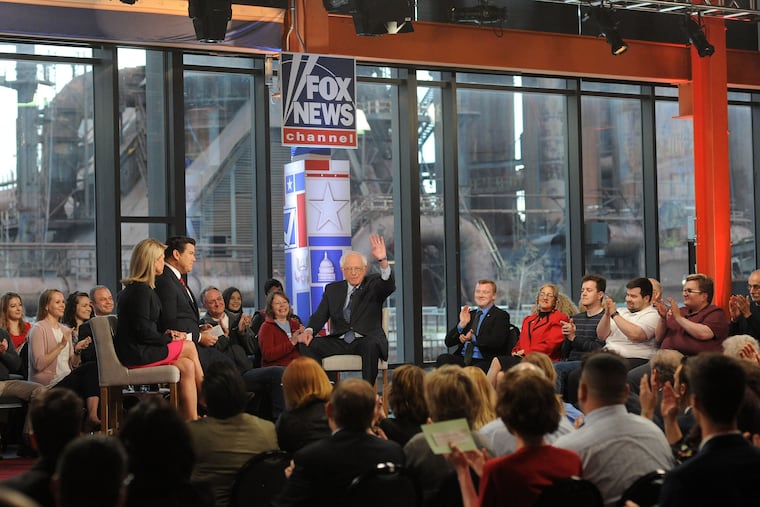 Democratic presidential candidate Bernie Sanders (right) waves as he answers questions from Fox News' Martha MacCallum (left) and Brett Baier (Center) during a Town Hall Meeting Monday, April 15, 2019 at Steel Stacks Event Center in Bethlehem, Pennsylvania. WILLIAM THOMAS CAIN / For The Inquirer.