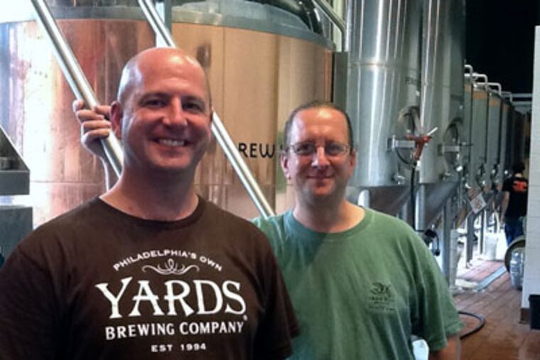 Tim Roberts (left), a longtime area brewer now at Yards, at Iron Hill's Maple Shade, N.J., brewpub for a collaborative brew with its head brewer, Chris LaPierre.