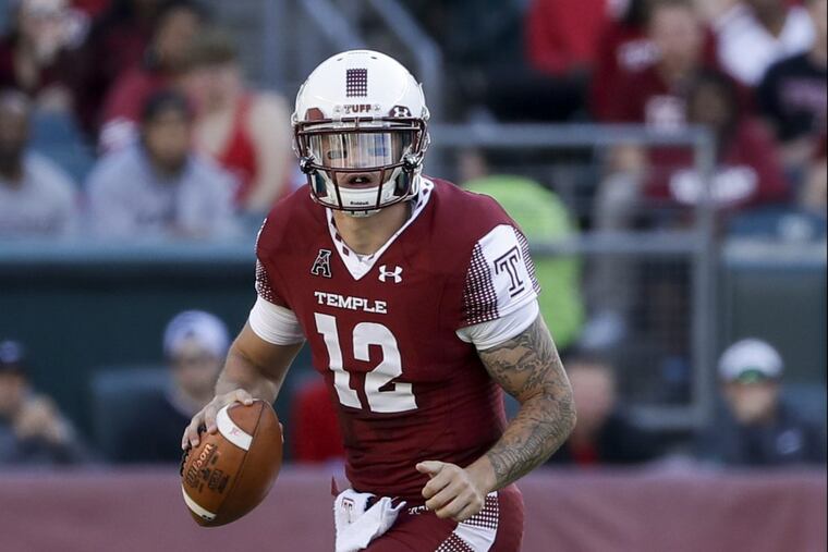 Temple quarterback Logan Marchi scrambles with the football against Villanova on Saturday, September 9, 2017 in Philadelphia. YONG KIM / Staff Photographer