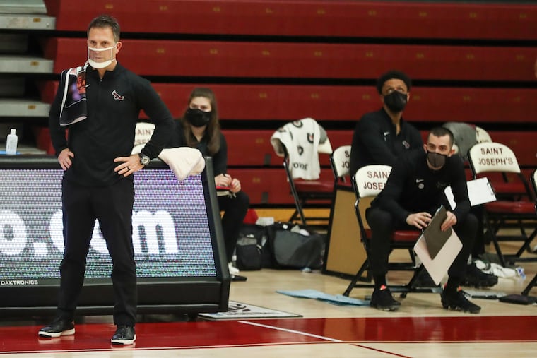 St. Joseph's men's basketball coach Billy Lange (left) is looking forward to a new practice facility for his Hawks.