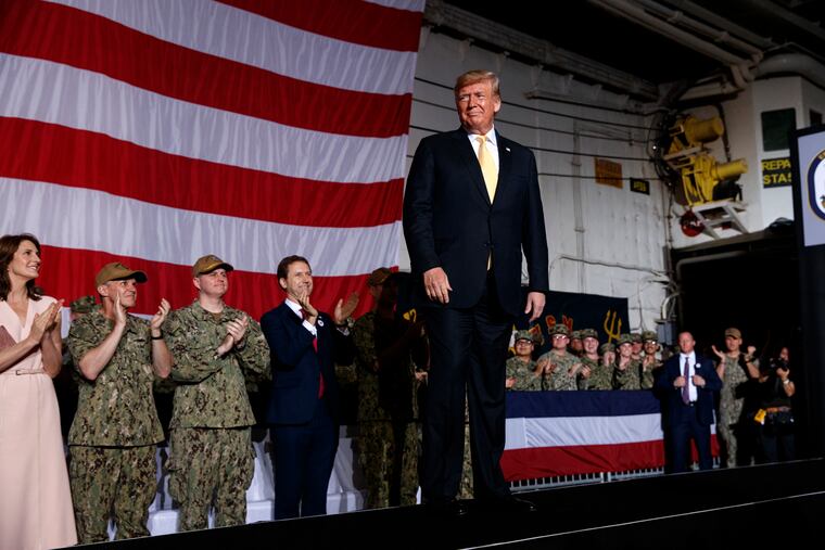 President Donald Trump arrives on stage to speak to troops at a Memorial Day event aboard the USS Wasp, Tuesday, May 28, 2019, in Yokosuka, Japan.