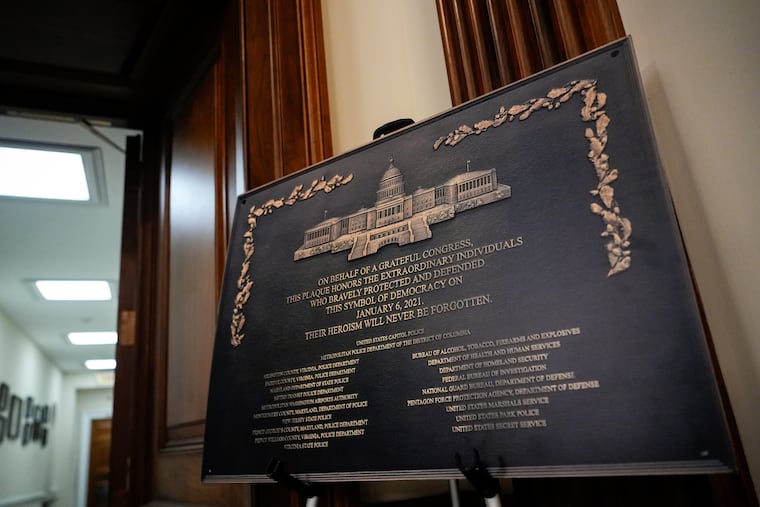 A replica plaque commemorating the Jan. 6, 2021, Capitol riot stands outside the office of House Minority Leader Hakeem Jeffries.