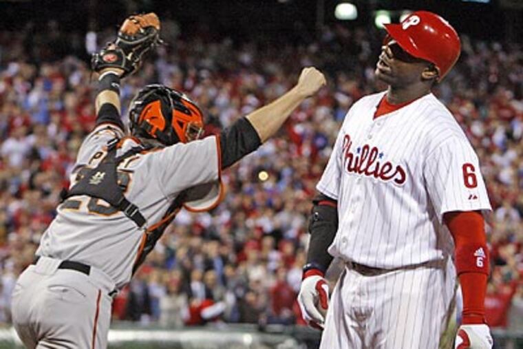 Ryan Howard strikes out looking for the final out, eliminating the Phillies from the postseason. ( Ron Cortes / Staff Photographer )