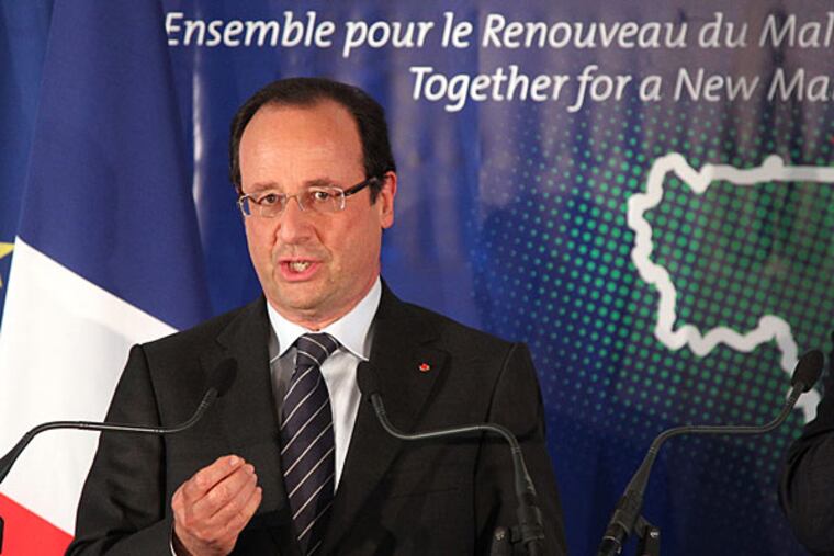 French President Francois Hollande addresses the media at the end of the Donor Conference for Development in Mali in Brussels, Wednesday, May 15, 2013. A plan to turn Mali into a stable democracy and prevent it from becoming a terrorist haven got a boost Wednesday as European nations lined up to pledge hundreds of millions of euros in aid for the conflict-ridden West African nation. (AP Photo/Yves Logghe)