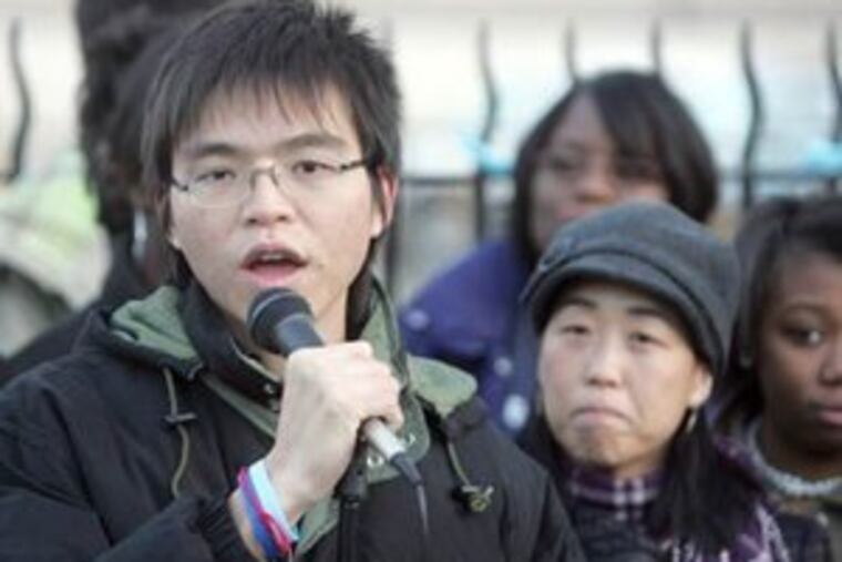 Duong Nghe Ly, left, and Helen Gym, right, speak during a rally last year in front of South Philadelphia High School at Broad and Snyder. Ly was awarded the Princeton Prize on Race Relations. (Staff File Photo)