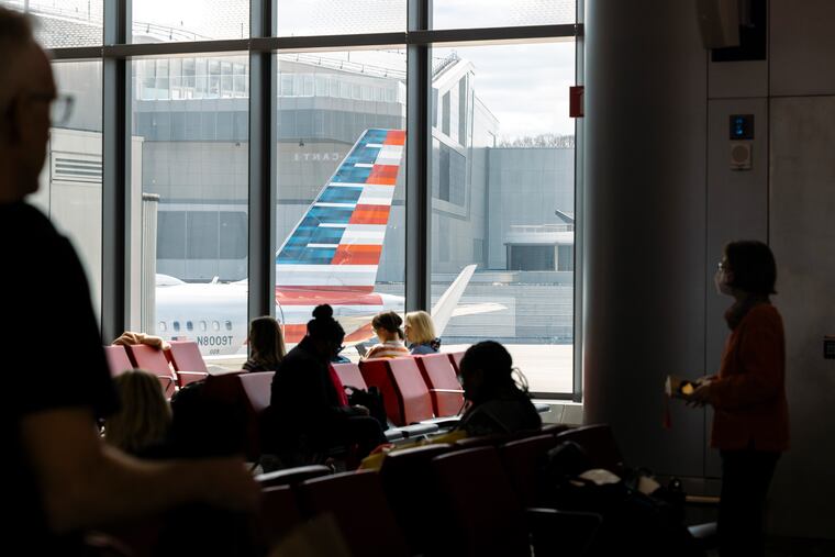 Passengers wait to board an American Airlines flight at LaGuardia Airport in Queens, N.Y., in April 2024.