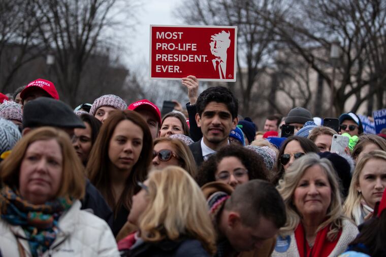 In this Jan. 24, 2020, file photo, supporters listen as President Donald Trump speaks during the annual March for Life rally on the National Mall in Washington. Anti-abortion leaders across America were elated a year ago when Trump became the first sitting U.S. president to appear in person at their highest-profile annual event, the March for Life, held every January. This year's March for Life will be virtual.