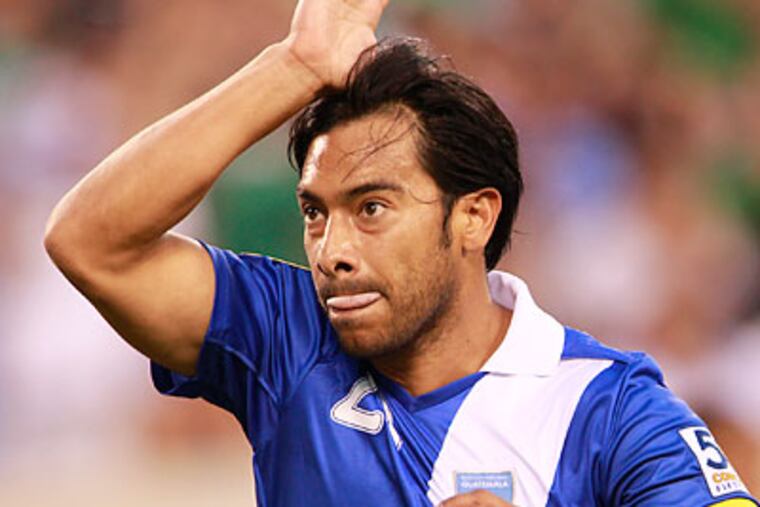 Union forward Carlos Ruiz scored for Guatemala in their Gold Cup quarterfinal loss to Mexico. (Julio Cortez/AP)