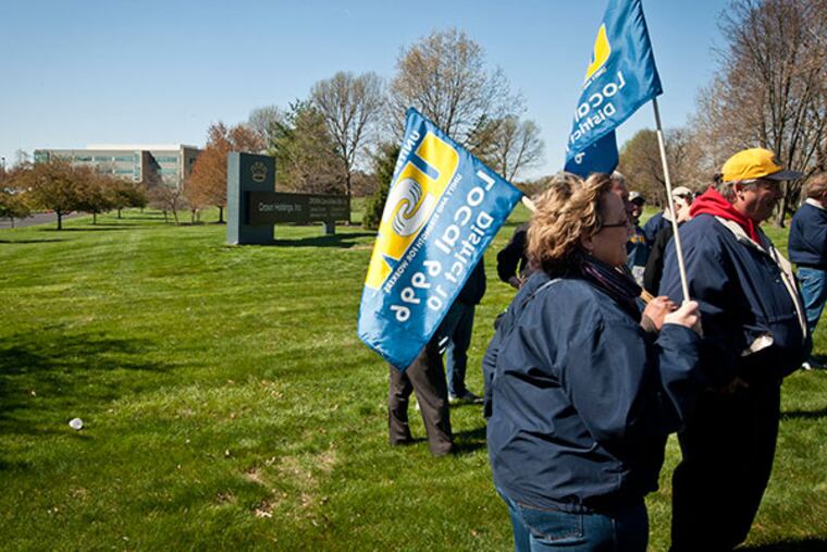 Members of United Steel Workers 6996 in Wyomissing, PA, protest outside Crown Holdings’ corporate headquarters in the Northeast on April 23, 2014. ( RON TARVER / Staff Photographer )