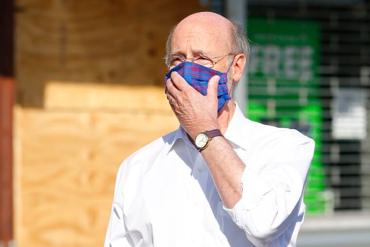 Gov. Tom Wolf said he was not experiencing symptoms.