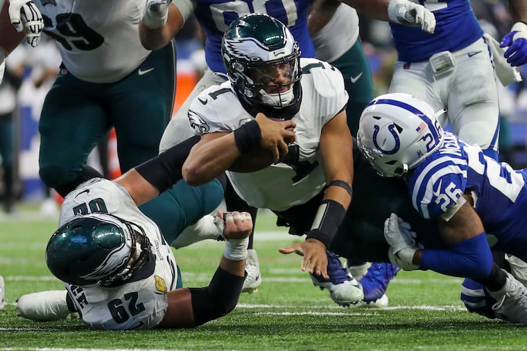 Eagles quarterback Jalen Hurts gets a first down in the fourth quarter against the Colts.