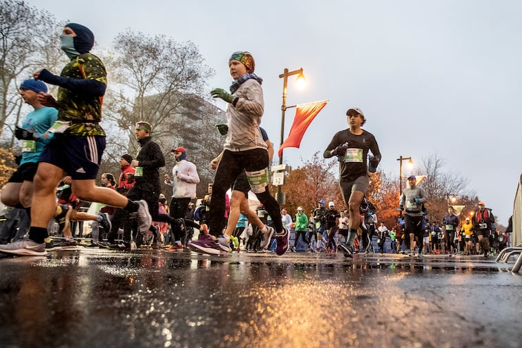 Runners take off down the Benjamin Franklin Parkway a the start of the Philadelphia Marathon on a cold wet Sunday morning on November 24, 2019. Most people do well with plenty of exercise, but in some cases endurance athletes might encounter heart issues.