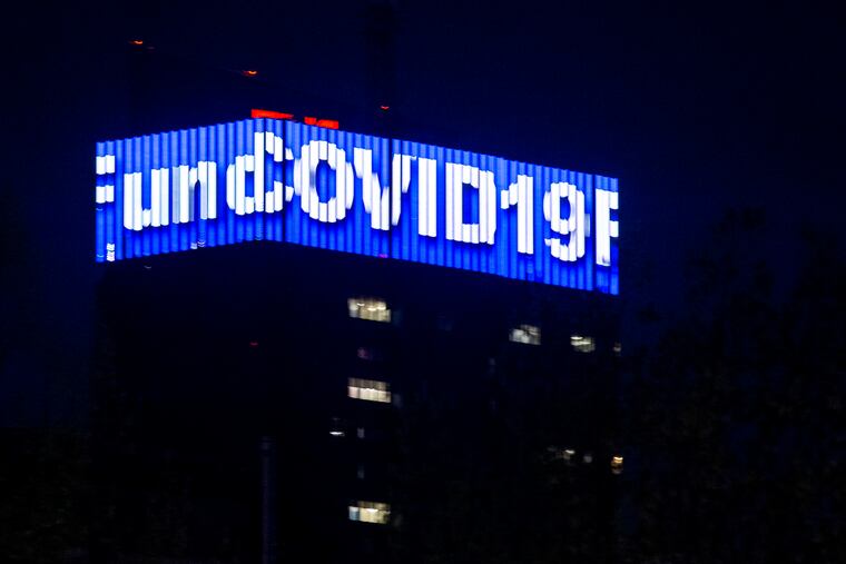 The PECO Crown Lights as the city lights up blue to honor healthcare workers in April.