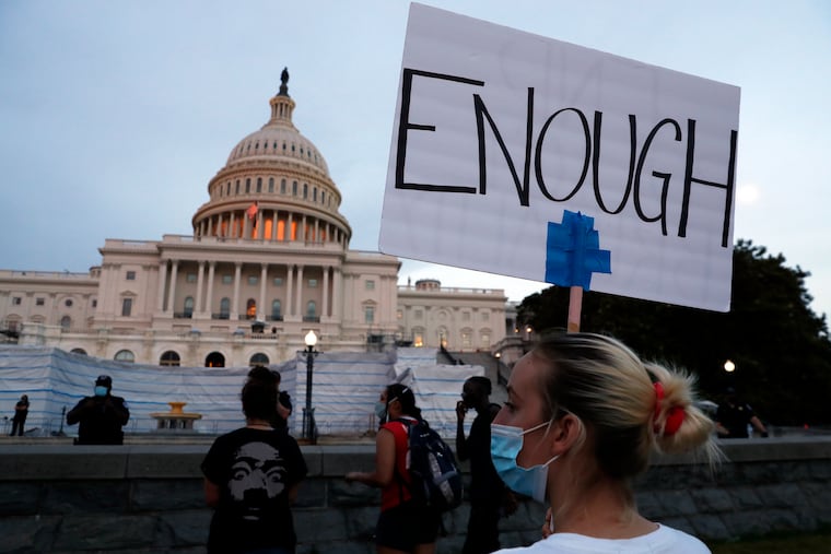 Demonstrators protest the death of George Floyd outside the U.S. Capitol in June 2020.