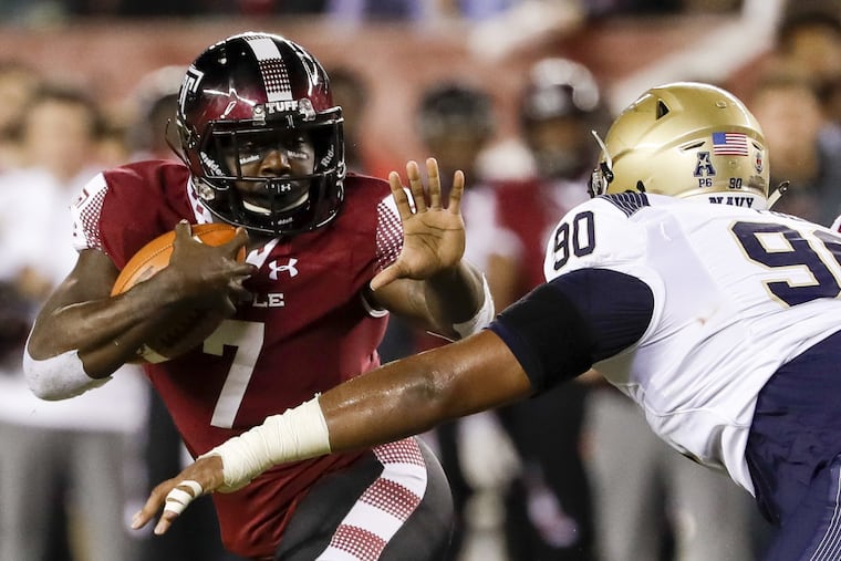 Temple running back Ryquell Armstead holds the football watching Navy defensive end Jarvis Polu during the second-quarter on Thursday, November 2, 2017 in Philadelphia. YONG KIM / Staff Photographer