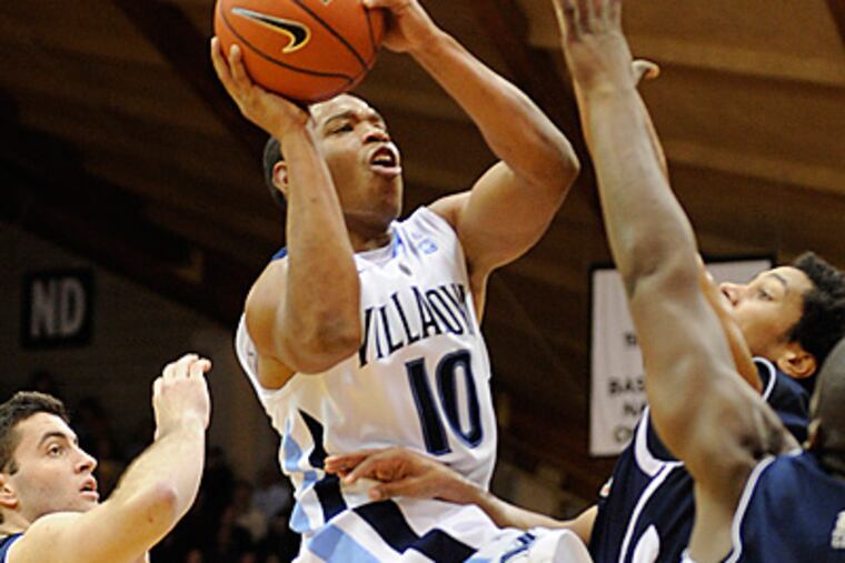 Villanova guard Corey Fisher drives to the basket during the first half. (AP Photo/Barbara Johnston)
