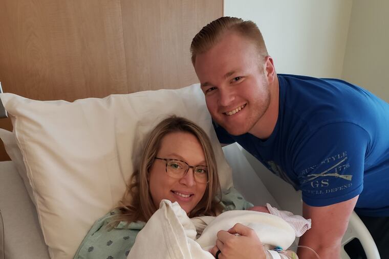 Sgt. Seth Craven and his wife, Julie, with their newborn son, Cooper.