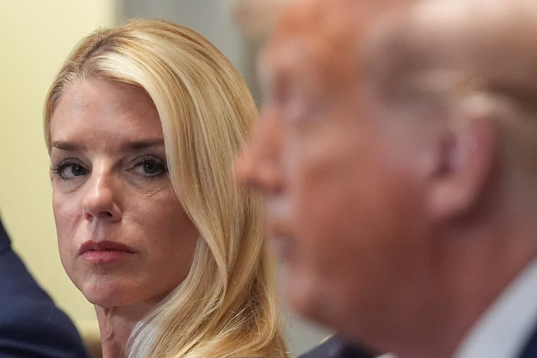 Attorney General Pam Bondi, left, listens as President Donald Trump, right, speaks during a cabinet meeting at the White House, Tuesday, July 8, 2025, in Washington.