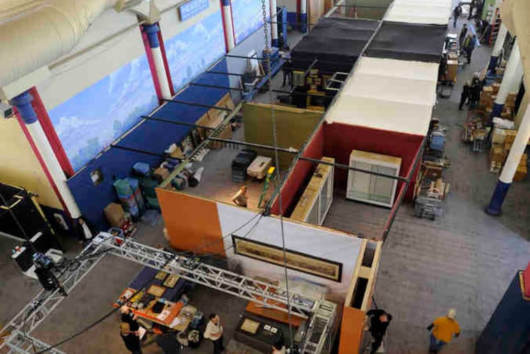 Dealers set up their booths at the Navy Yard for the 2011 Philadelphia Antiques & Art Show. This year's show will open this weekend.