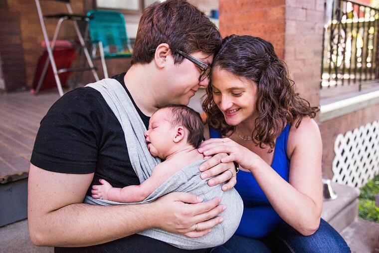 Bets Beasley (left) and Tiffany Holder with their baby, Charlotte. (Photo credit: Yana and Chita Photography)