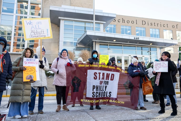 More than 50 parents, teachers, and community members rallied Thursday to protest proposed school closures.