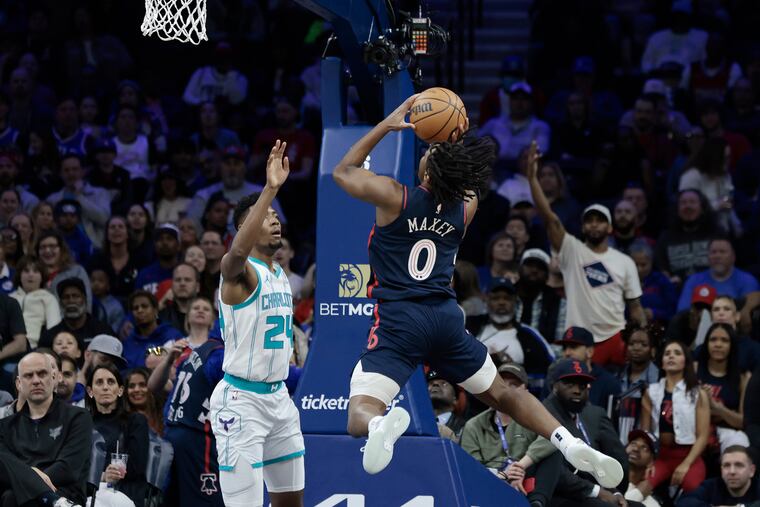 Sixers' Tyrese Maxey goes to the net against Hornets' Brandon Miller at the Wells Fargo Center on March 16.