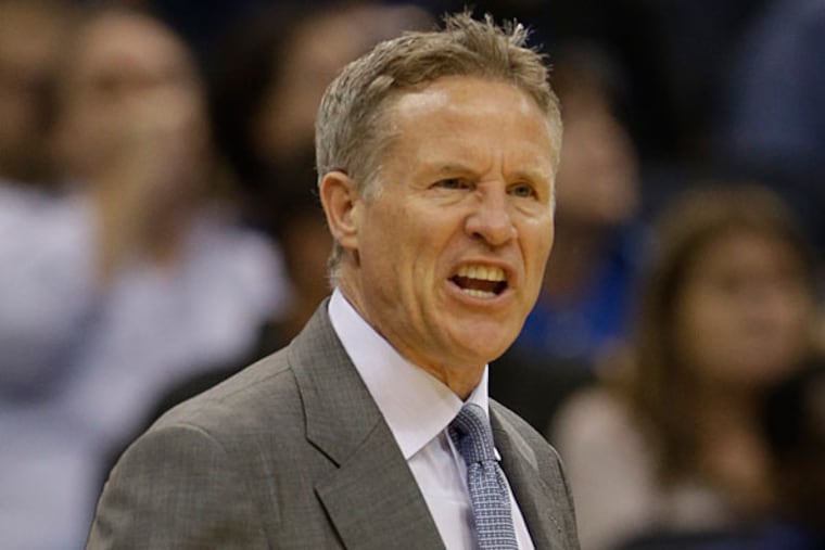 Brett Brown directs his players against the Orlando Magic during the second half of an NBA basketball game in Orlando, Fla., Sunday, March 2, 2014. Orlando won 92-81. (John Raoux/AP)