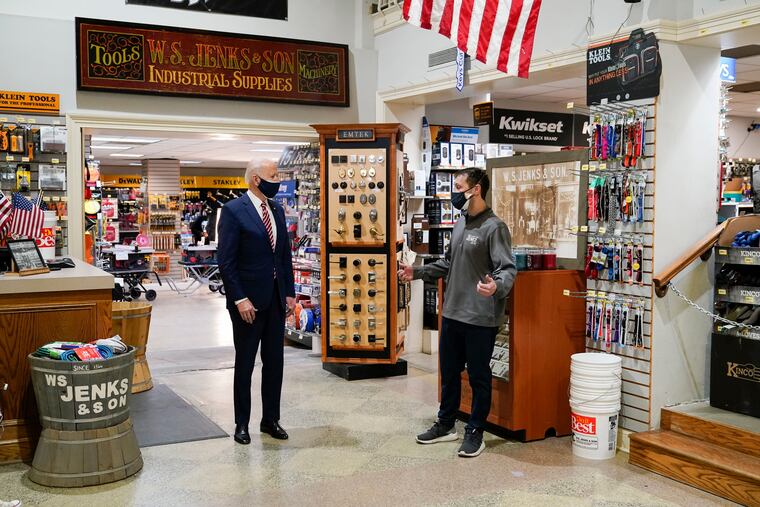 President Joe Biden (left) speaks with Michael Siegel, co-owner of W.S. Jenks & Son, a small firm that got a Paycheck Protection Program loan, in Washington last week.