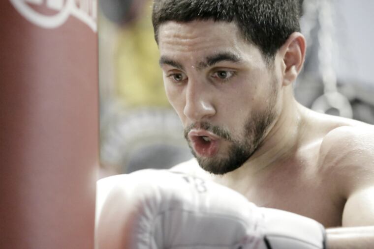 Danny Garcia hits the heavy bag during his workout before the media. (Elizabeth Robertson / Staff Photographer)