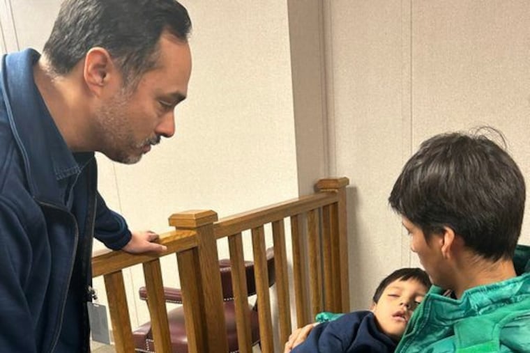 U.S. Rep. Joaquin Castro, left, visits with 5-year-old Liam Conejo Ramos and his father, Adrian Alexander Conejo Arias, at the South Texas Family Residential Center in Dilley, Texas, Wednesday, Jan. 28. 2026.