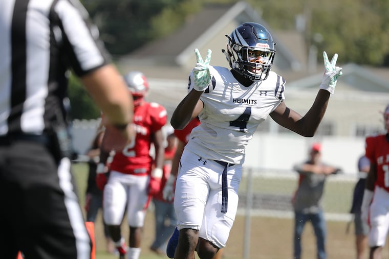 St. Augustine's Nasir Hill celebrates a touchdown in the first quarter.