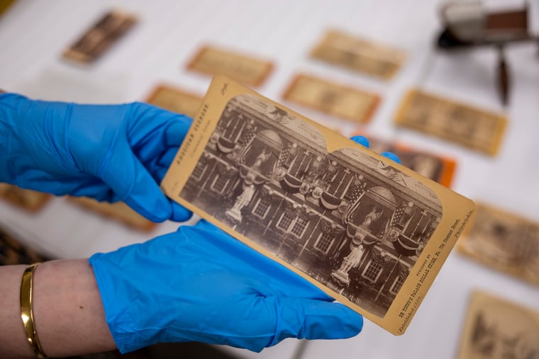 A stereoscope photocard shows of the outside of Independence Hall in 1876.